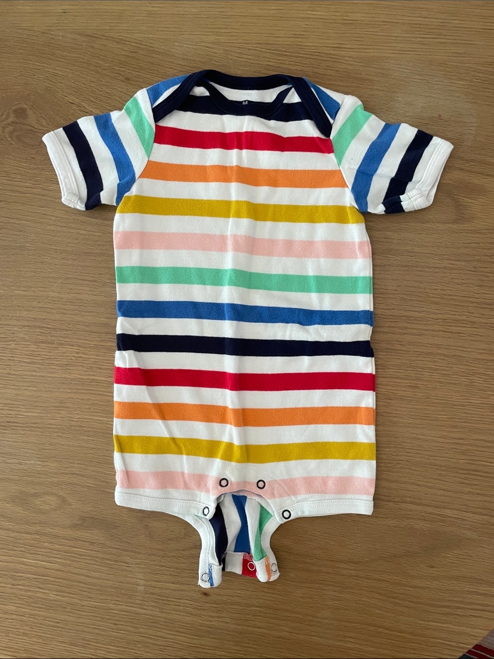 Primary rainbow onesie - size 18-24mths